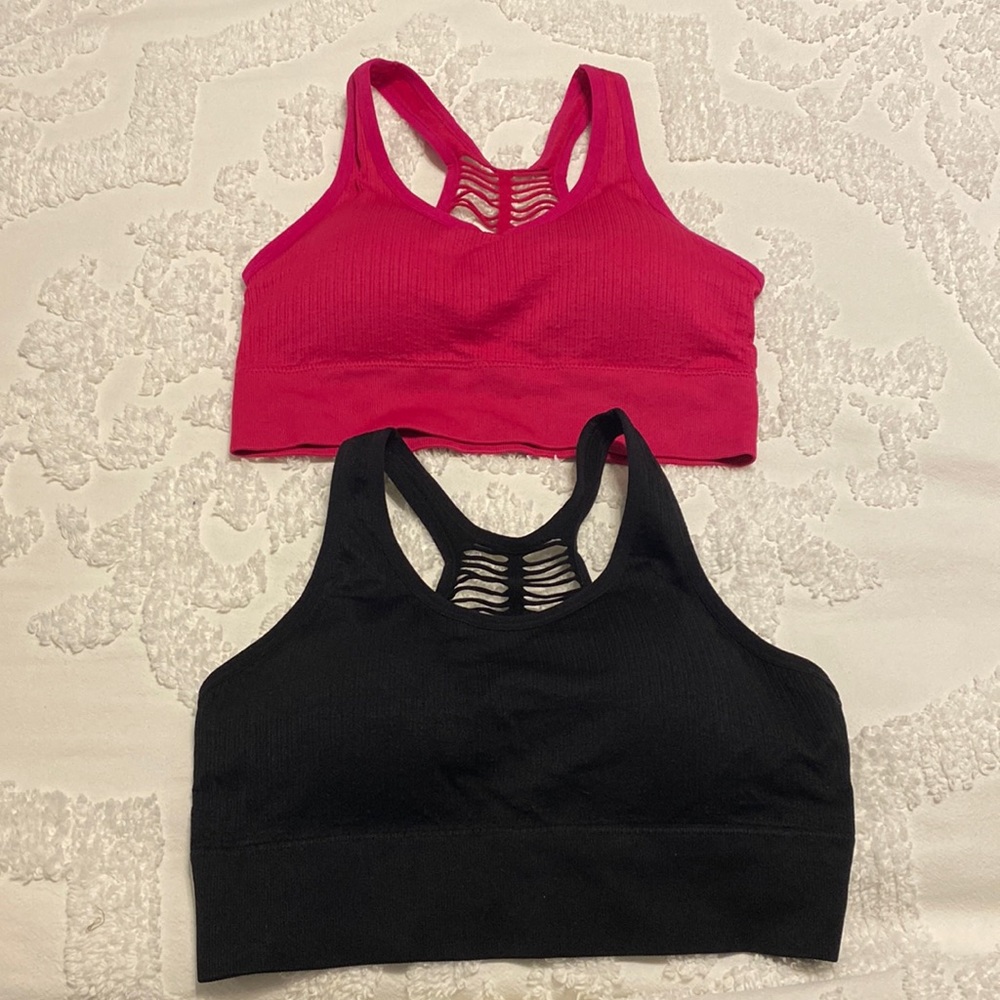 2 Sports Bras: 1 dark pink and 1 black with removable padding